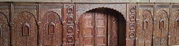 Big indian door, carving archway as entrance of hotel, resturant or villa